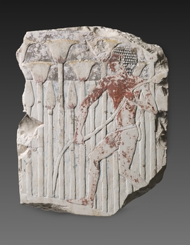 Relief sculpté montrant un homme dans un fourré de papyrus